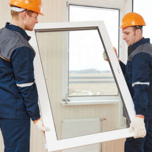 two men installing replacement windows 