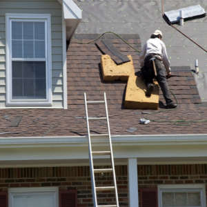 roofer installing new shingles